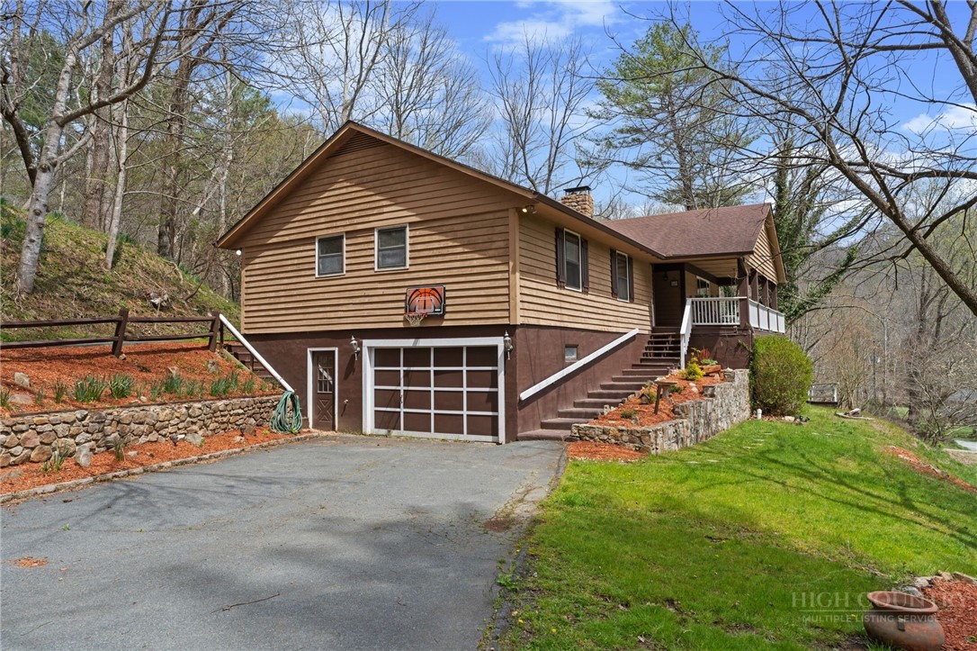 2345 Watauga River Road Sugar Grove, NC 28679 - Photo 2 of 50 a view of a house with a yard and wooden fence