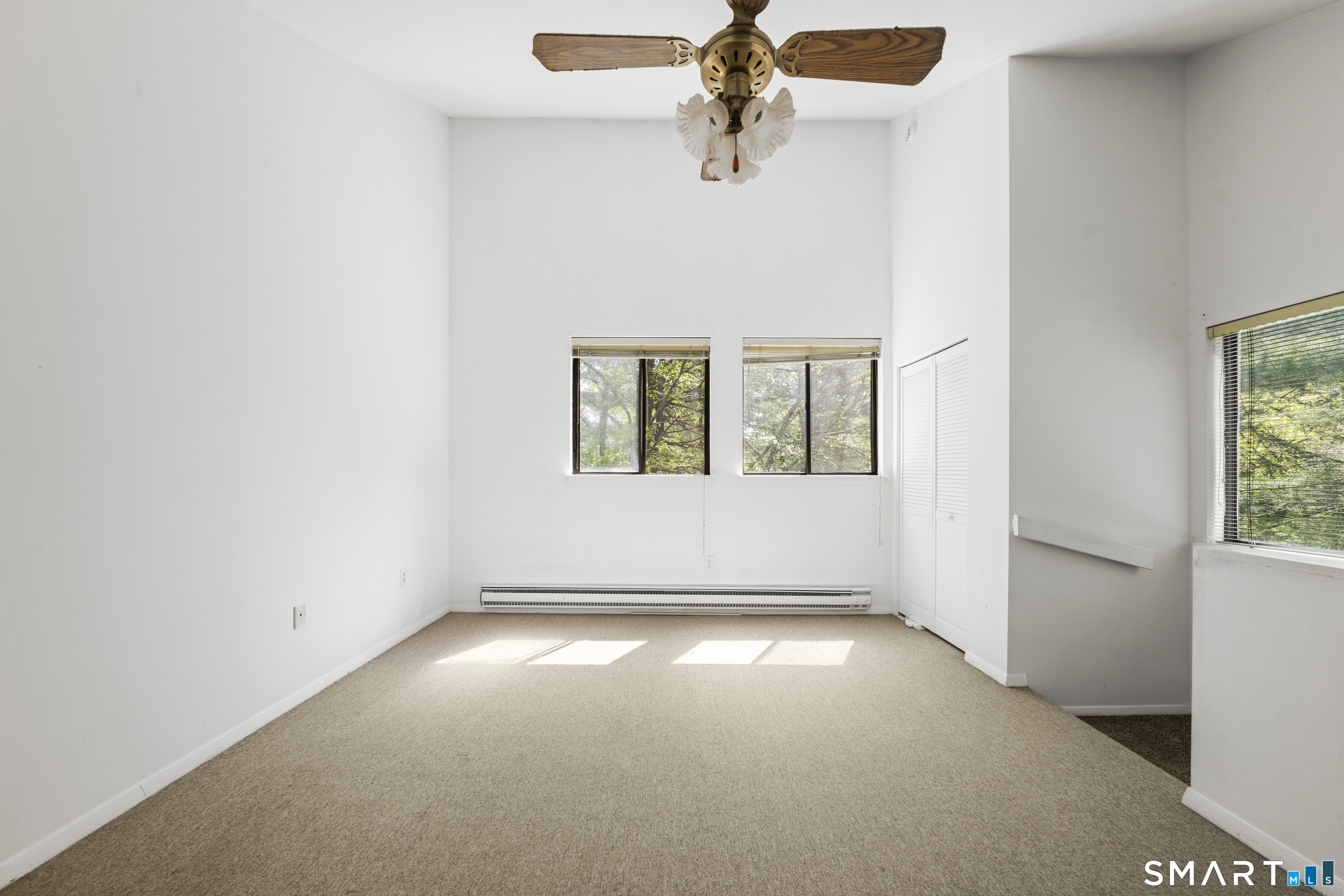 39 Evergreen Road, Unit 39 Torrington, CT 06790 - Photo 13 of 27 an empty room with windows and fan
