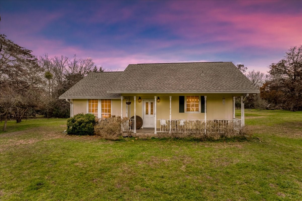 312 Smith Road Bastrop, TX 78602 - Photo 1 of 1 Beautiful porch to relax & enjoy the large property.
