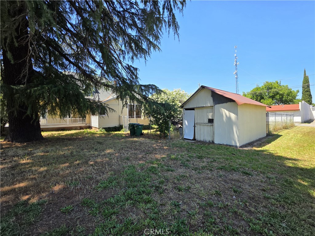 1414 Marin Street Corning, CA 96021 - Photo 40 of 43 a view of a house with backyard and trees