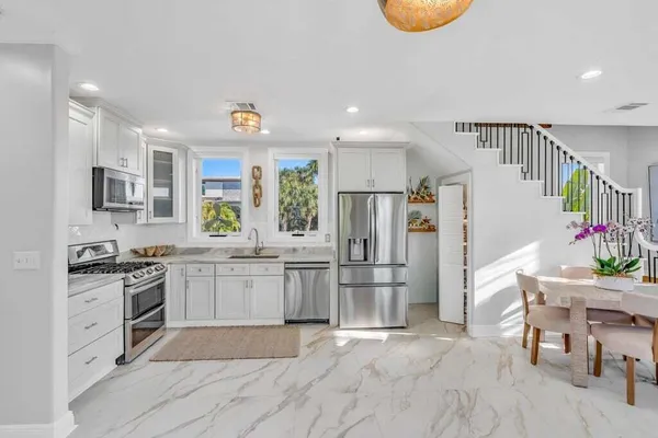 a picture of a bathroom with a shower