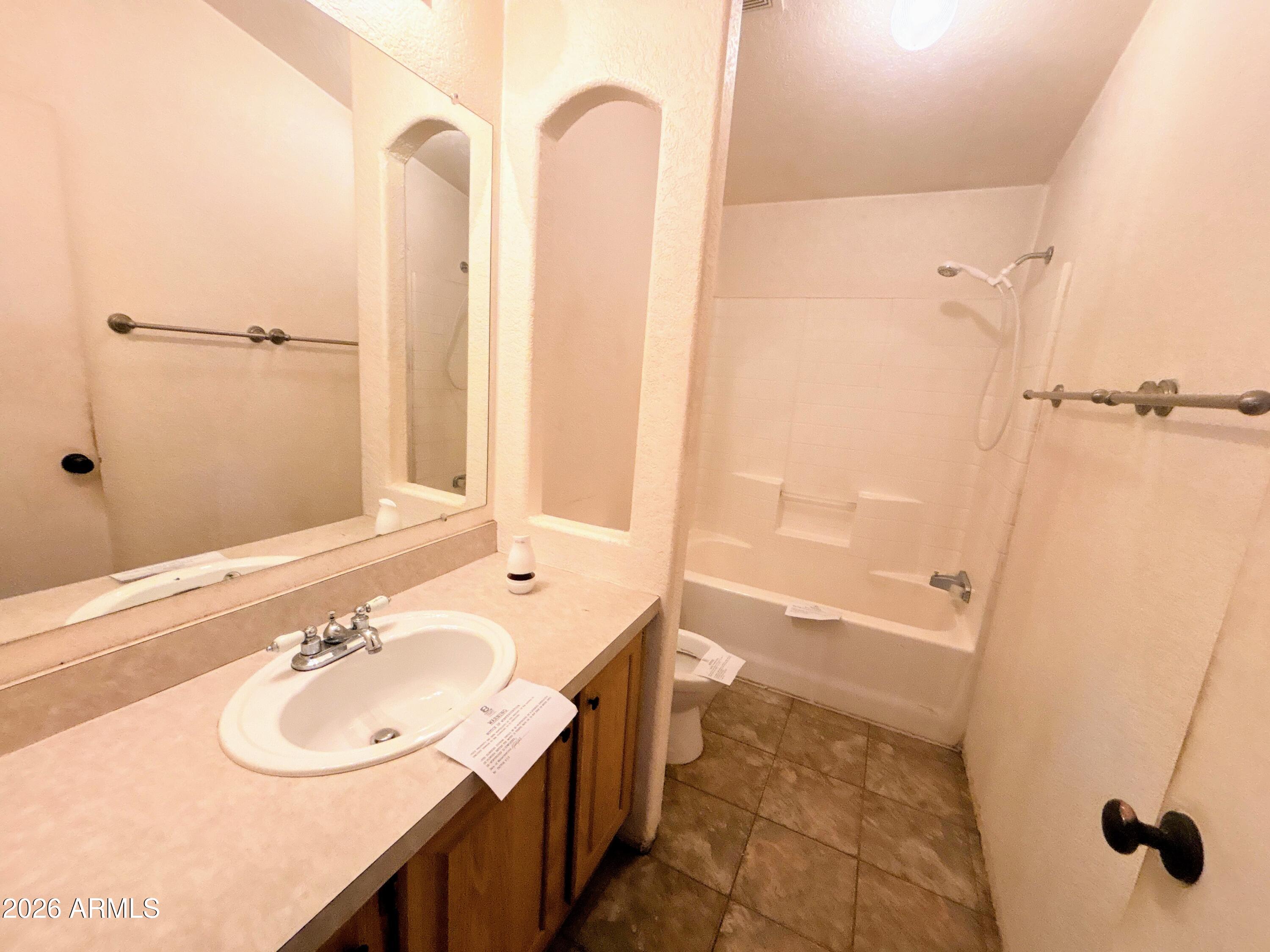 4038 Colt Road Snowflake, AZ 85937 - Photo 21 of 35 a bathroom with a sink and a shower