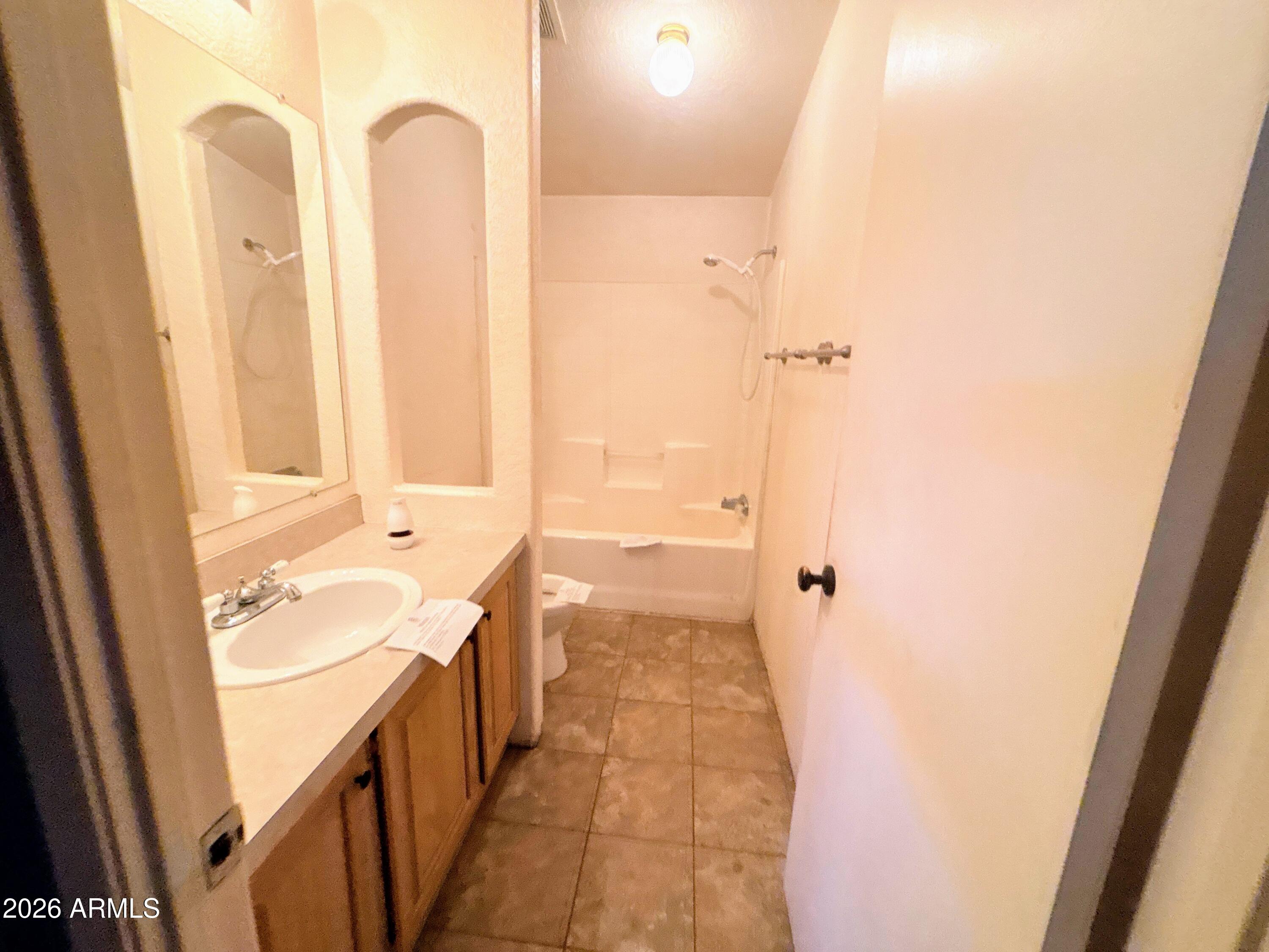 4038 Colt Road Snowflake, AZ 85937 - Photo 22 of 35 a bathroom with a tub sink and shower