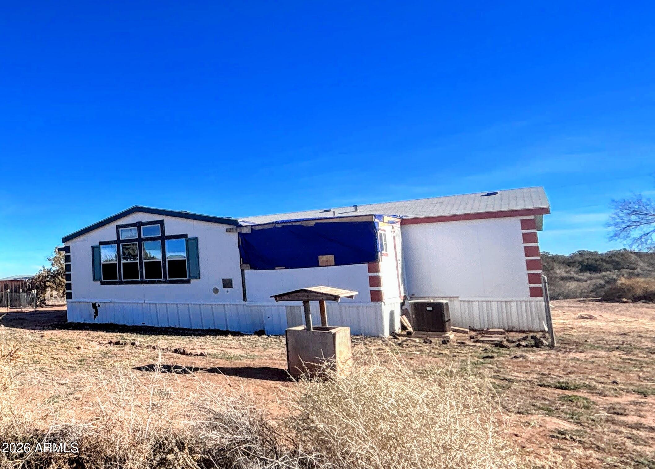 4038 Colt Road Snowflake, AZ 85937 - Photo 33 of 35 a front view of a house with a yard