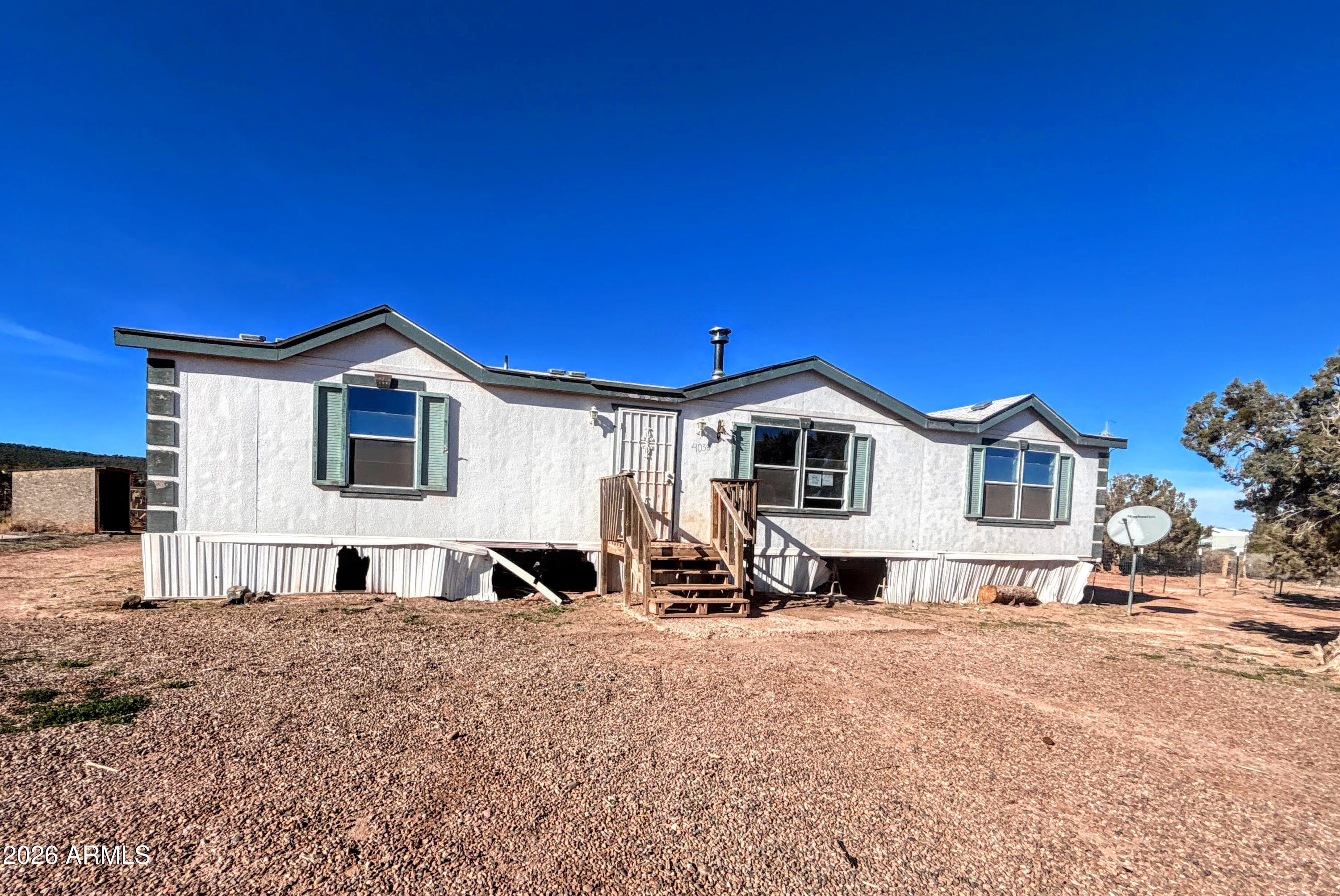 4038 Colt Road Snowflake, AZ 85937 - Photo 34 of 35 a front view of a house with a yard