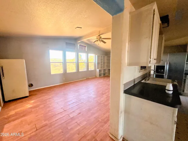 a bathroom with a tub sink and shower