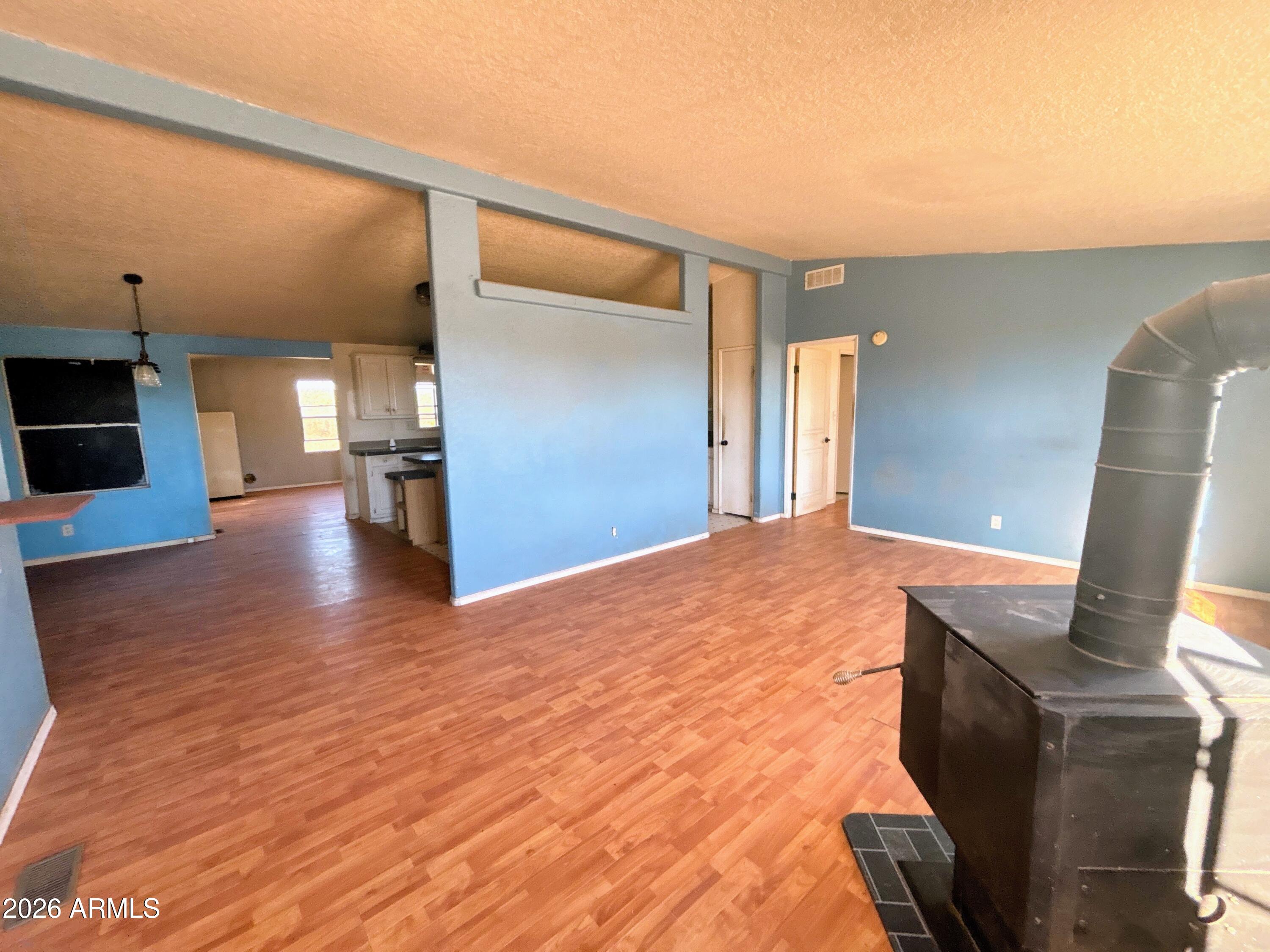 4038 Colt Road Snowflake, AZ 85937 - Photo 8 of 35 a view of empty room with wooden floor