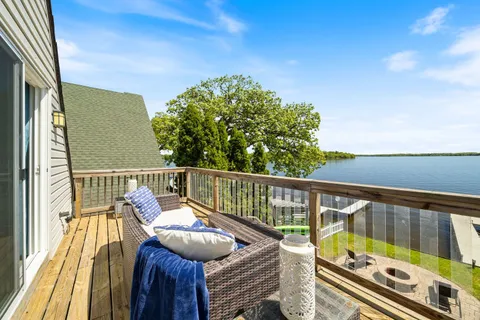 a view of balcony with wooden floor