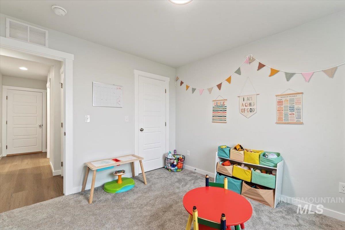 4086 North Kithnos Avenue Meridian, ID 83646 - Photo 17 of 29 Playroom featuring carpet