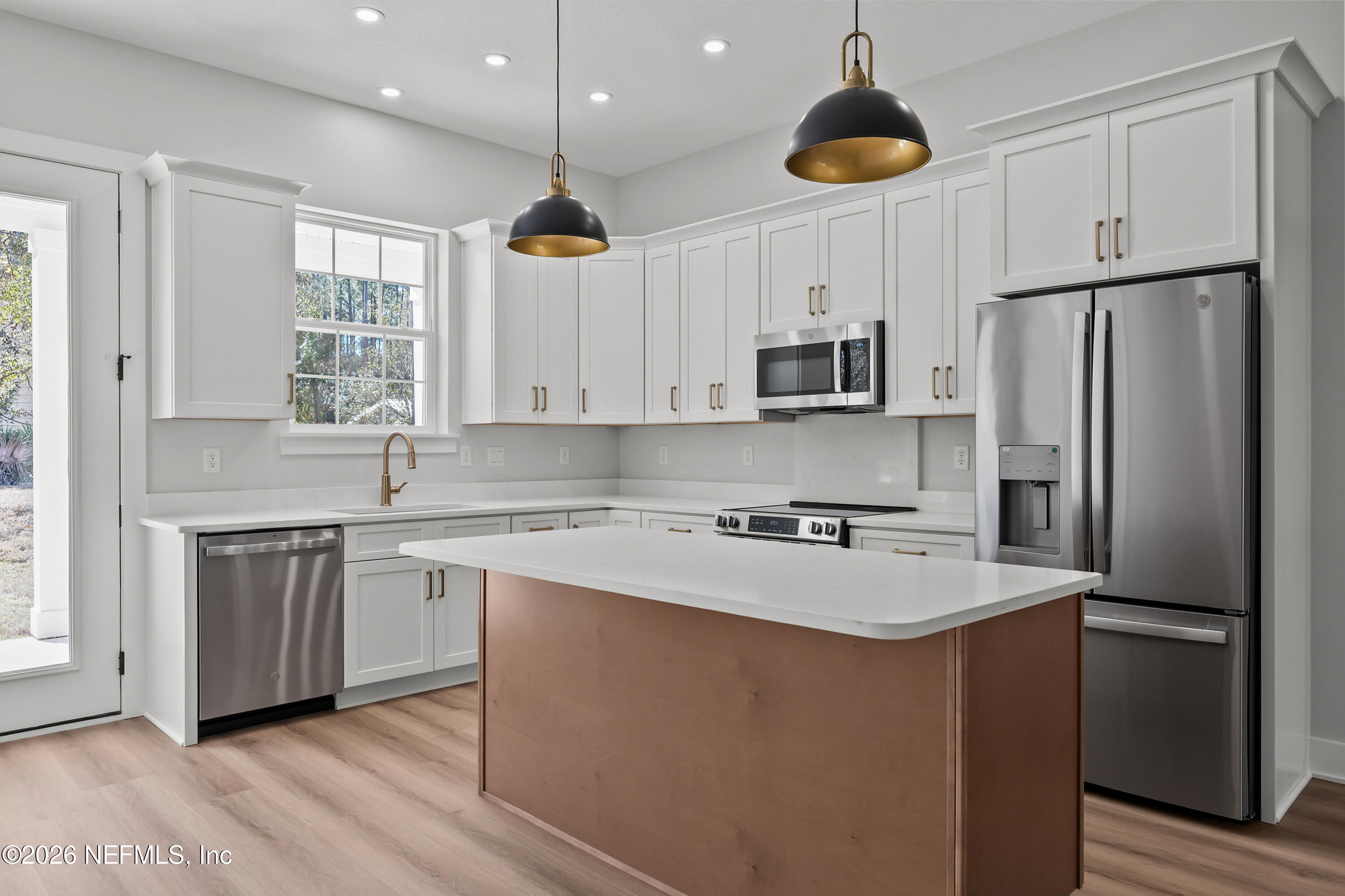 543 Palmetto Bluff Road Palatka, FL 32177 - Photo 2 of 23 a kitchen with stainless steel appliances a refrigerator sink and microwave