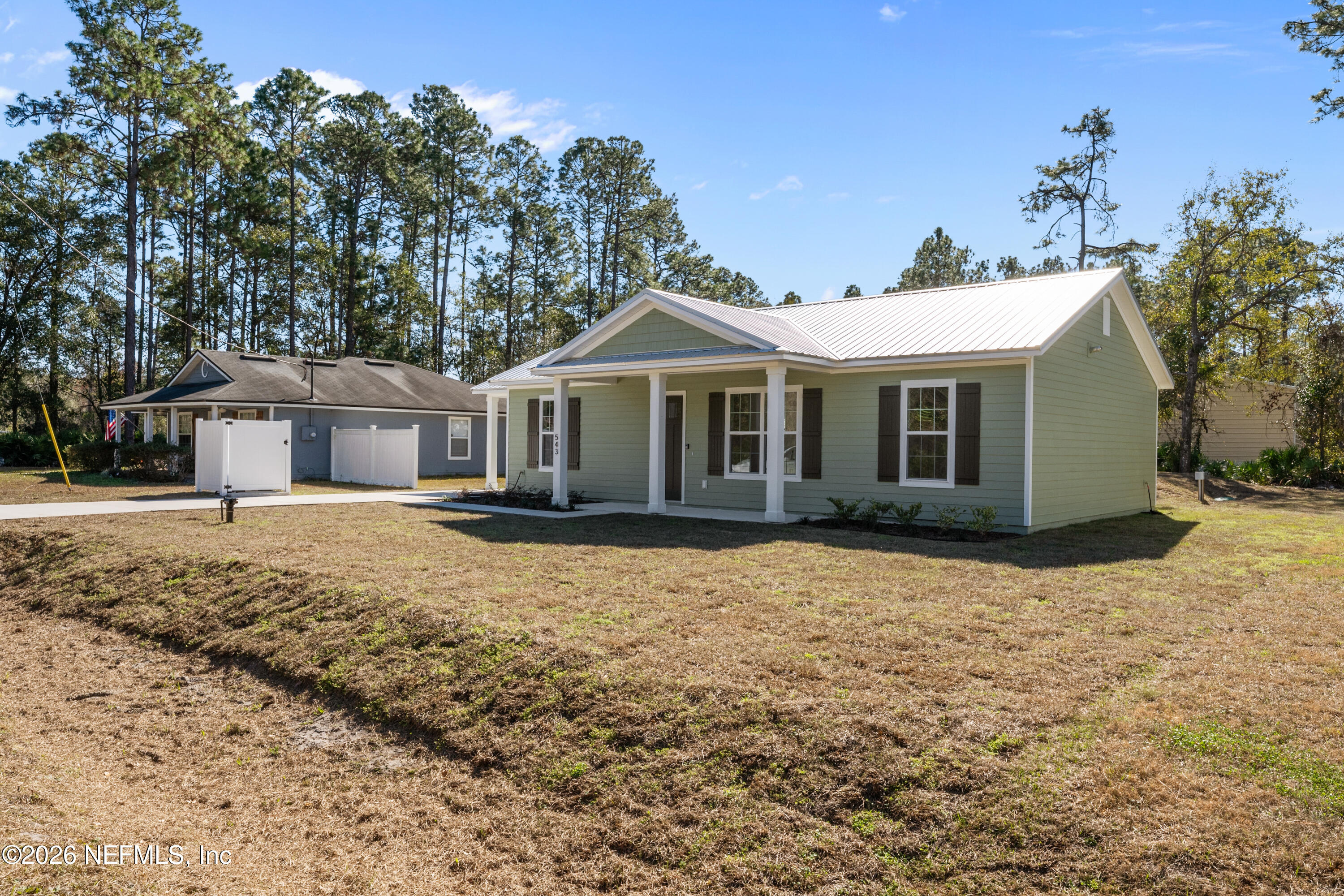 543 Palmetto Bluff Road Palatka, FL 32177 - Photo 5 of 23 a front view of a house with a yard