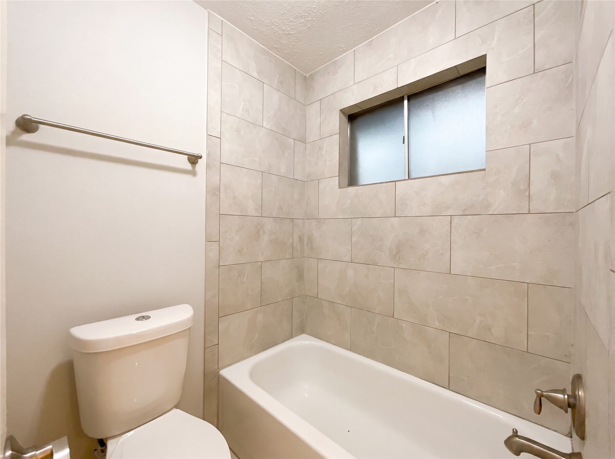 23110 Pennsgrove Road Spring, TX 77373 - Photo 14 of 16 a bathroom with a toilet and a bathtub