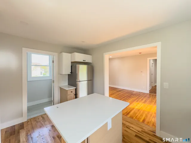 a view of kitchen and wooden floor
