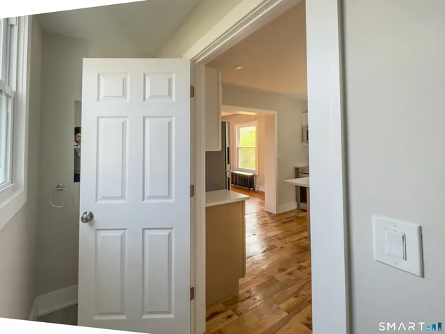 a view of a livingroom with wooden floor
