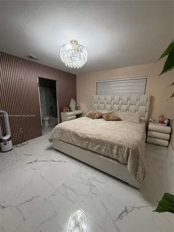a bedroom with a bed and a table