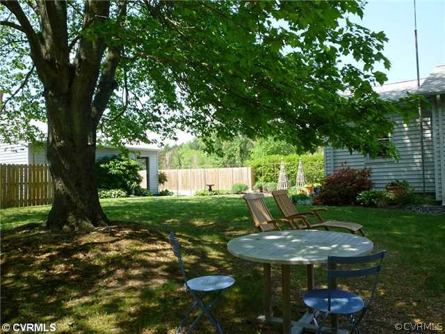 449 CCC Road Crewe, VA 23930 - Photo 3 of 12 a view of a backyard with table and chairs and a large tree