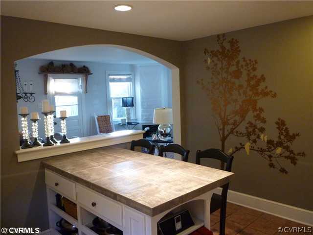 449 CCC Road Crewe, VA 23930 - Photo 8 of 12 a room with a table chairs and wooden floor