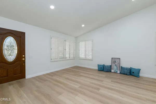 a bedroom with a bed and a mirror