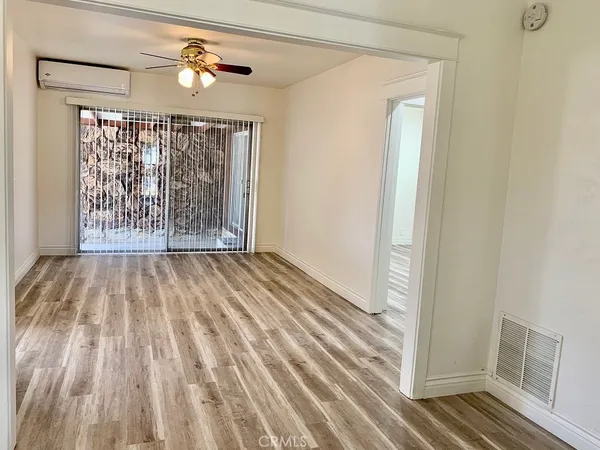 a view of entryway with wooden floor