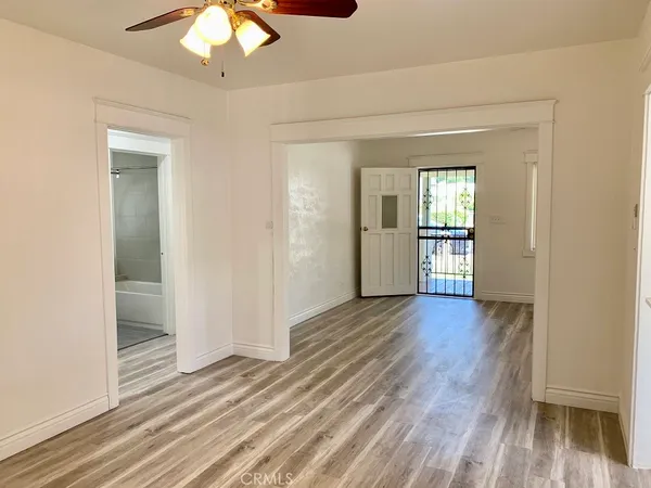 a view of a livingroom with wooden floor