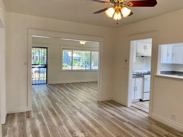 wooden floor in an empty room and a window