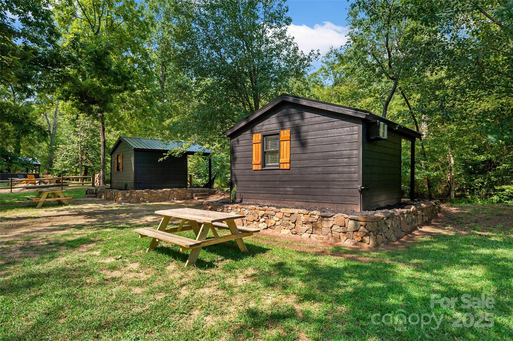 43 Polly Spout Road Marion, NC 28752 - Photo 14 of 34 a backyard of a house with table and chairs