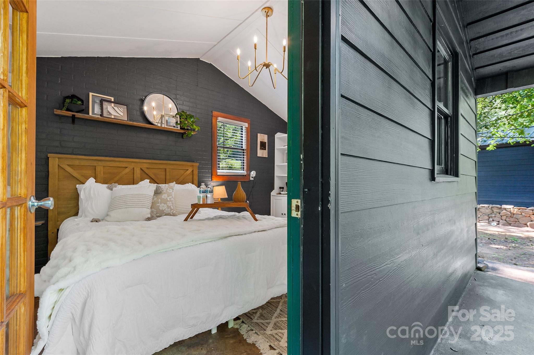 43 Polly Spout Road Marion, NC 28752 - Photo 15 of 34 a bed room with a bed and a painting on the wall