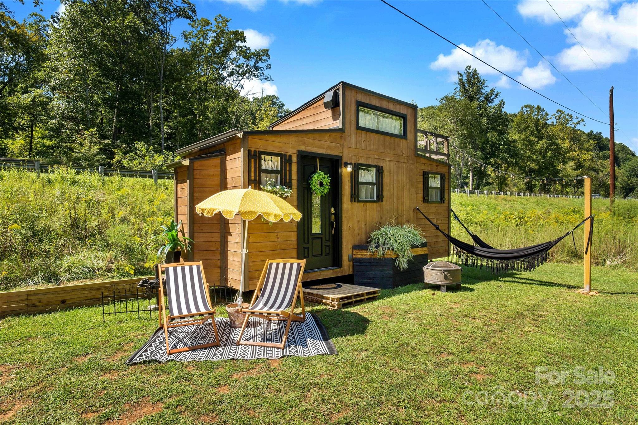 43 Polly Spout Road Marion, NC 28752 - Photo 16 of 34 a front view of a house with swimming pool yard and outdoor seating