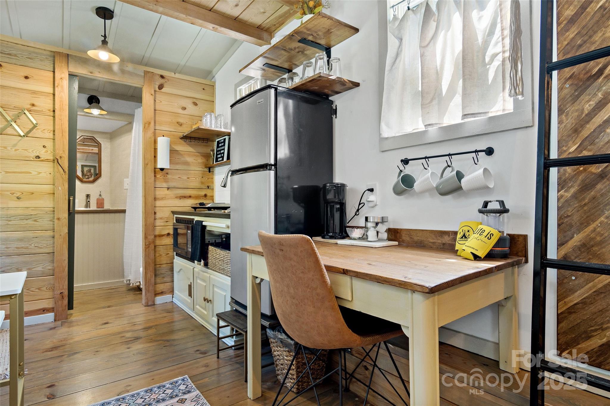 43 Polly Spout Road Marion, NC 28752 - Photo 18 of 34 a kitchen with stainless steel appliances granite countertop a table chairs and a refrigerator
