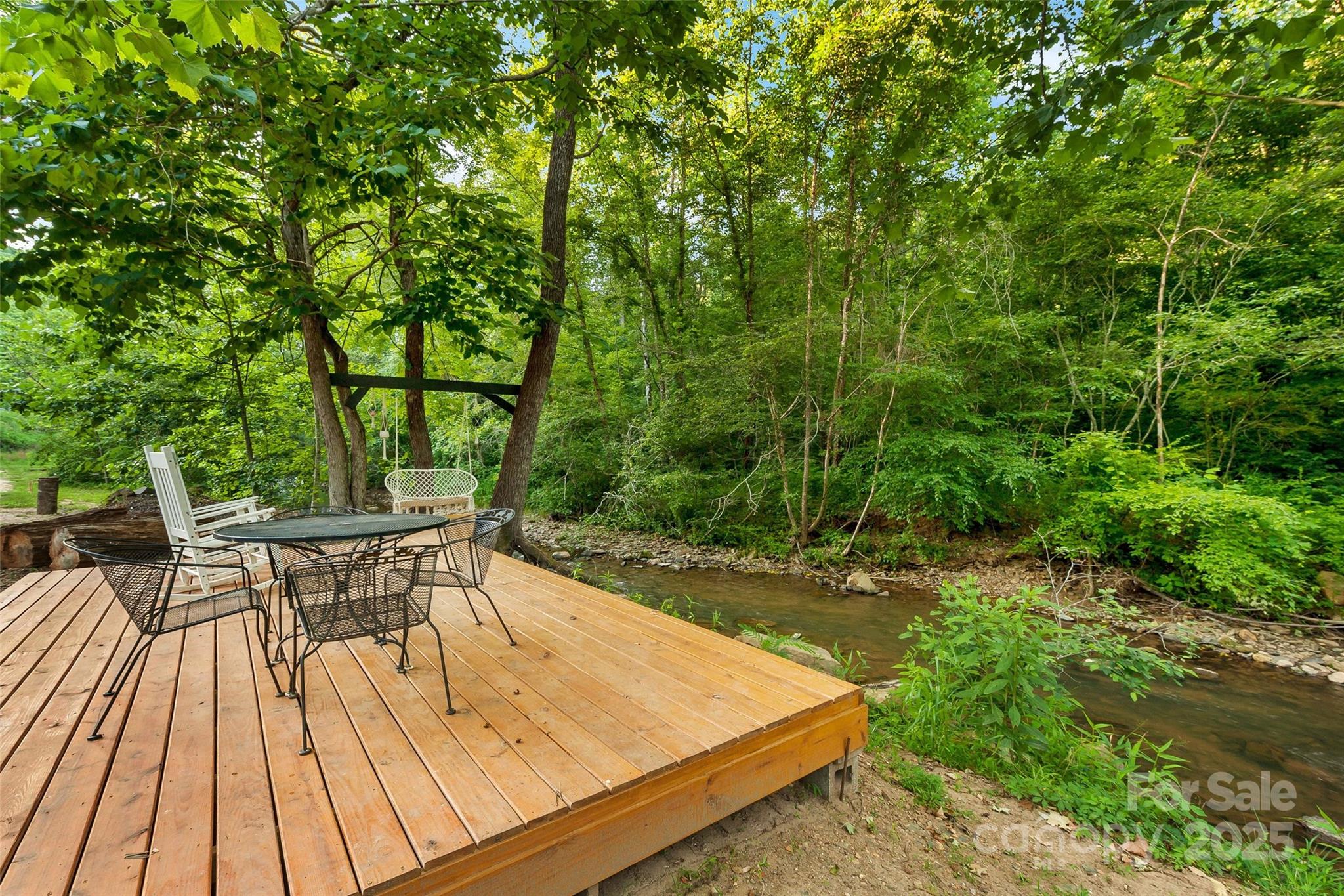 43 Polly Spout Road Marion, NC 28752 - Photo 20 of 34 a view of a patio with table and chairs and wooden floor