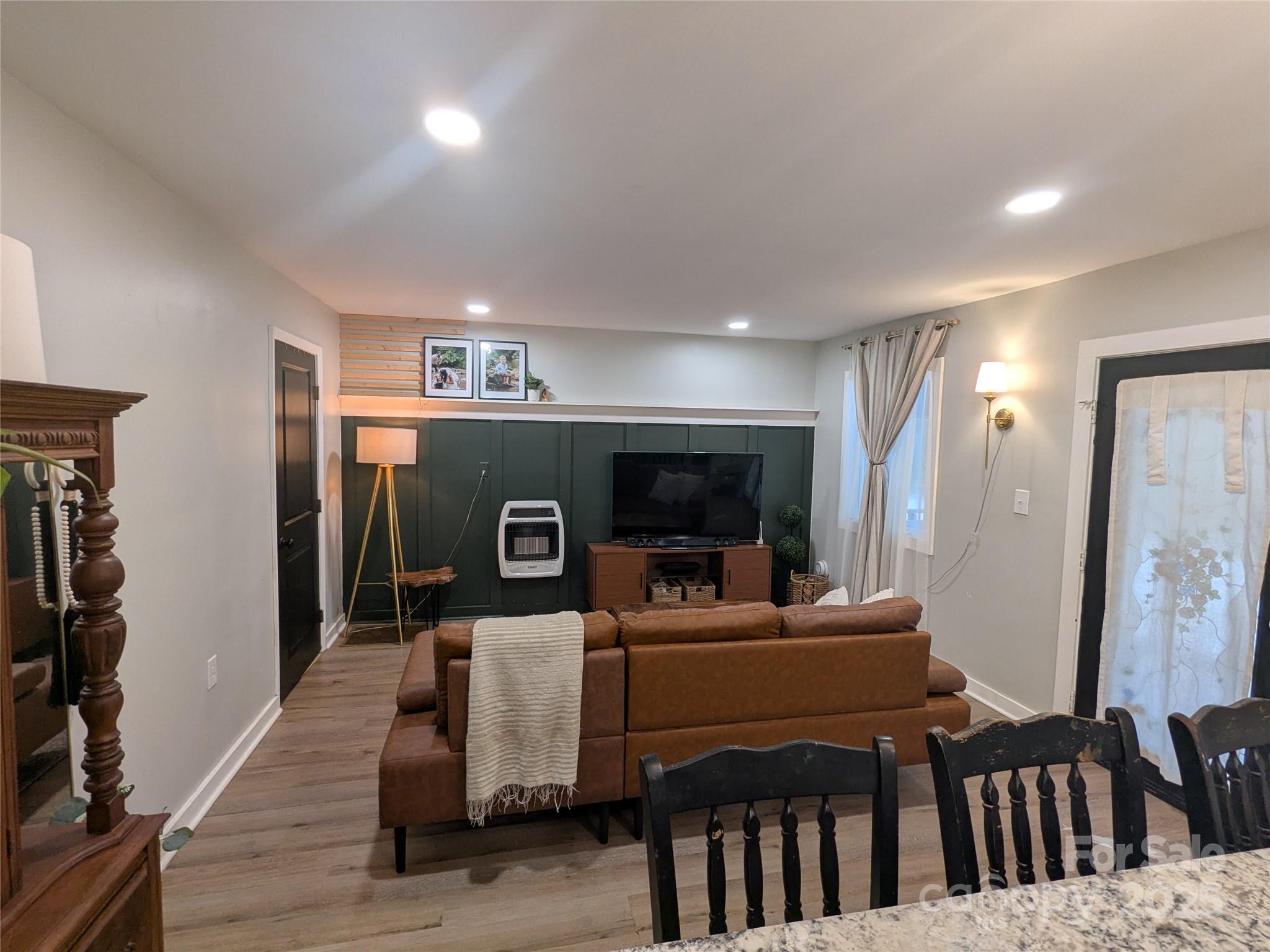 43 Polly Spout Road Marion, NC 28752 - Photo 28 of 34 a living room with furniture and a flat screen tv