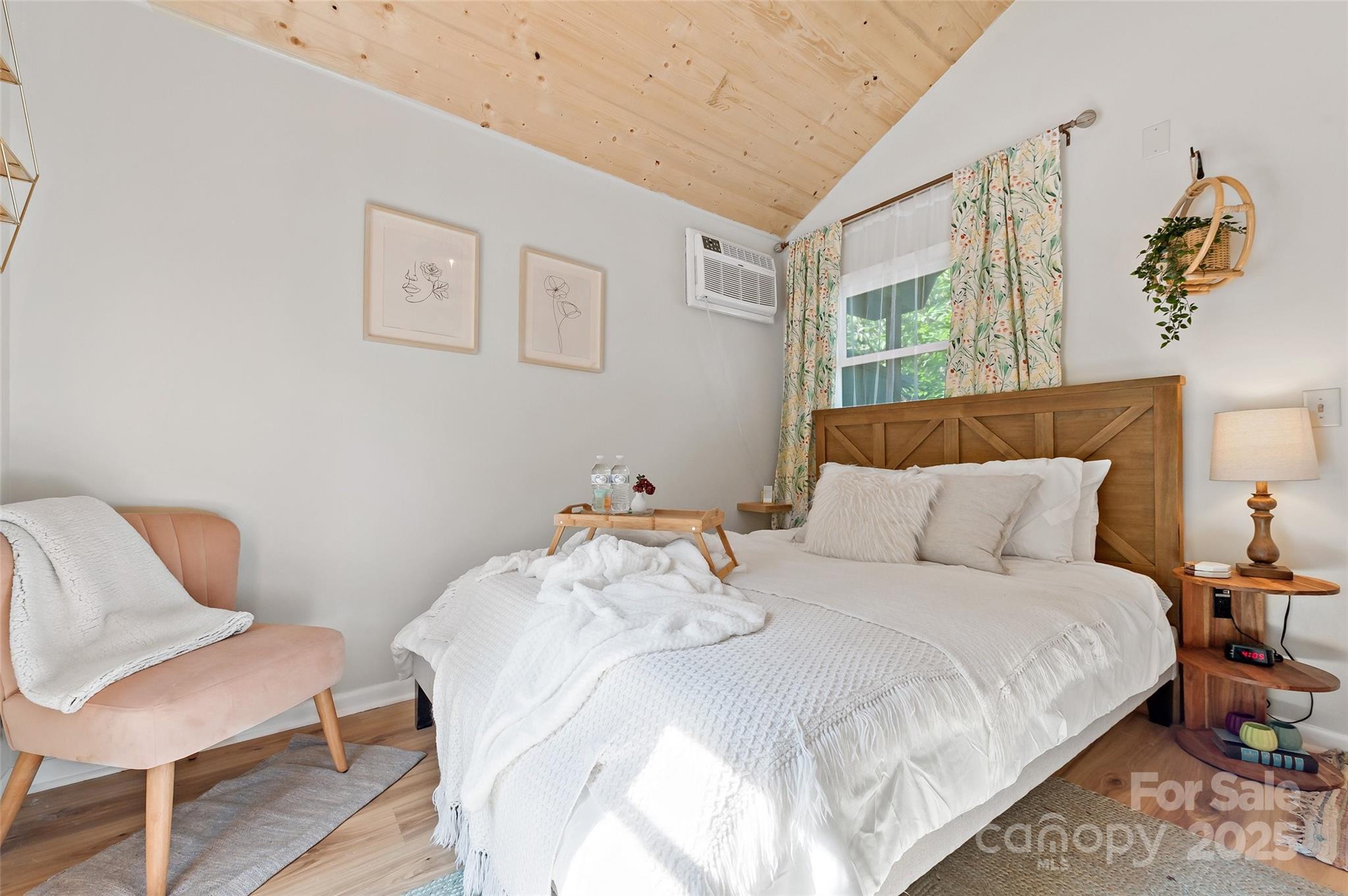 43 Polly Spout Road Marion, NC 28752 - Photo 10 of 34 a bedroom with a bed and a chair