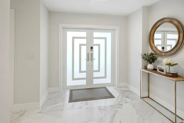 a large white room with cabinets
