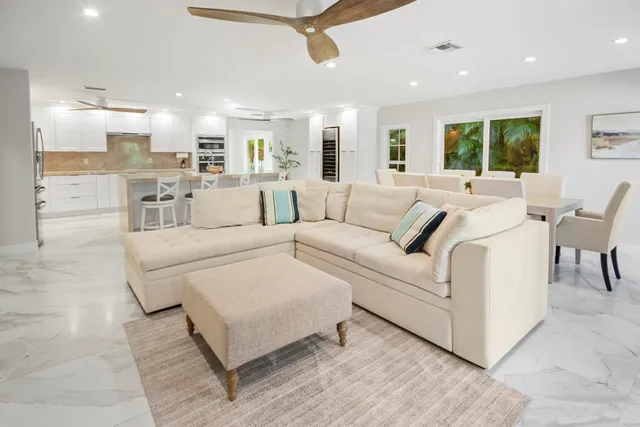 a bedroom with a bed a table and window