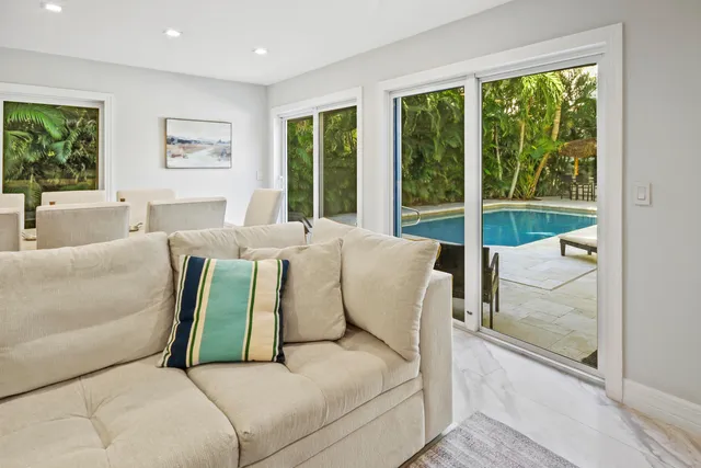 a spacious bedroom with a bed and a table in it