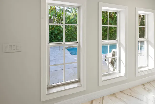 a view of bedroom with a bed and a window