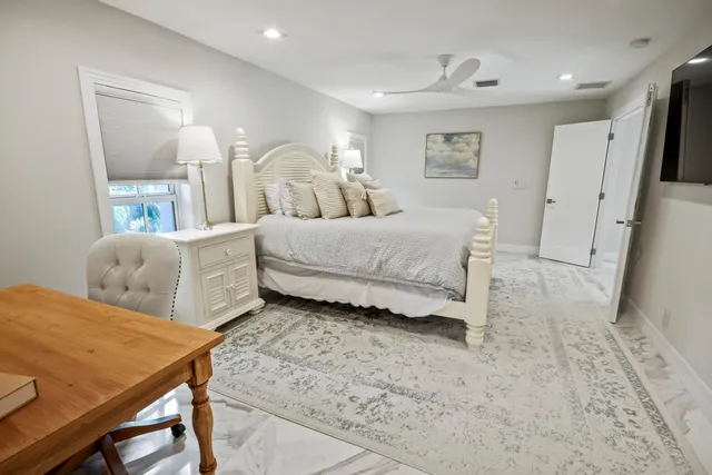 a bathroom with a tub sink and window