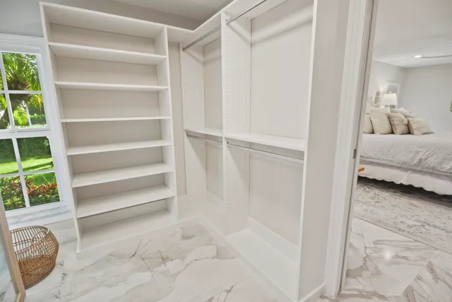 a bathroom with a granite countertop toilet sink and shower