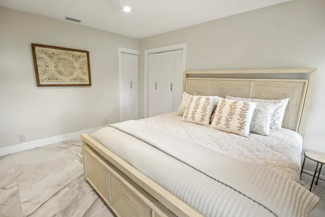 a bathroom with a sink mirror toilet and shower