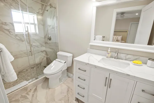 a view of a house with swimming pool and sitting area