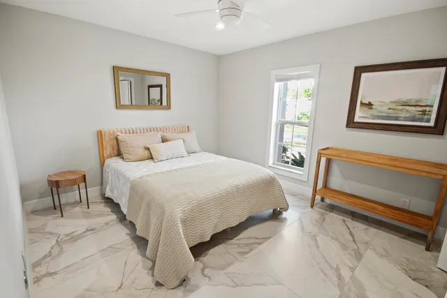 a building outdoor space with patio furniture and potted plants