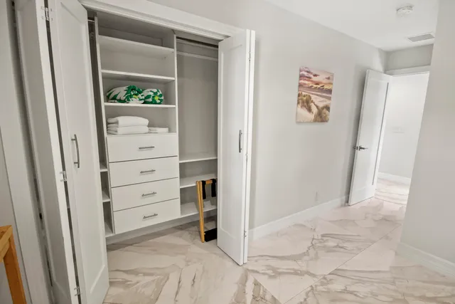 a view of a house with swimming pool and sitting area