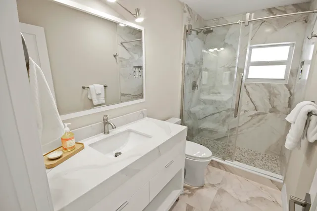 a view of a chairs and table in the patio