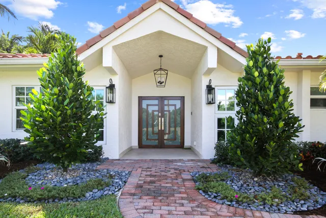 an aerial view of a house with a garden