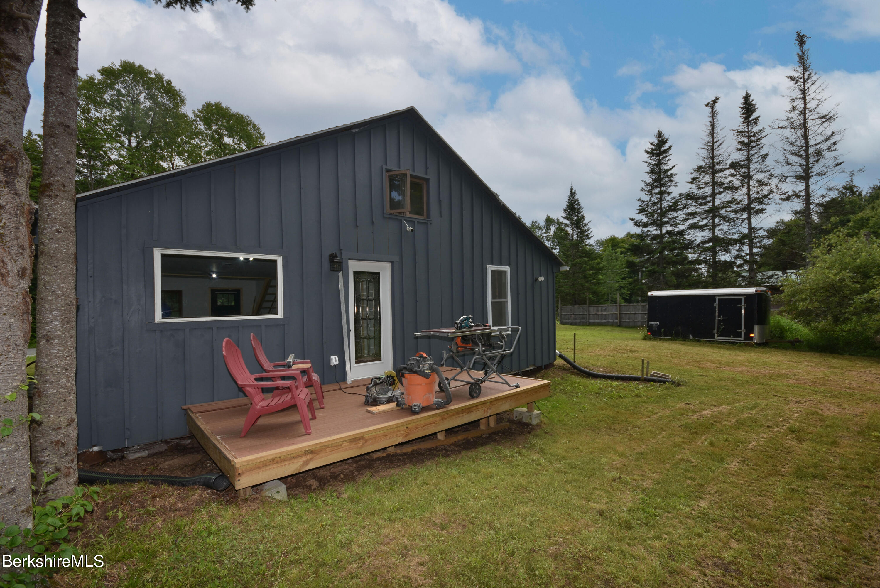 523 Center Road Savoy, MA 01256 - Photo 29 of 31 a backyard of a house with yard fire pit barbeque oven and outdoor seating