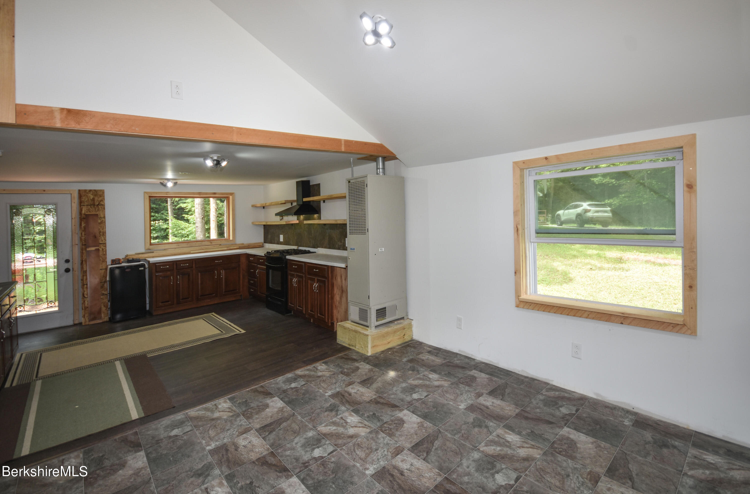 523 Center Road Savoy, MA 01256 - Photo 5 of 31 a large kitchen with kitchen island a stove a sink and a refrigerator