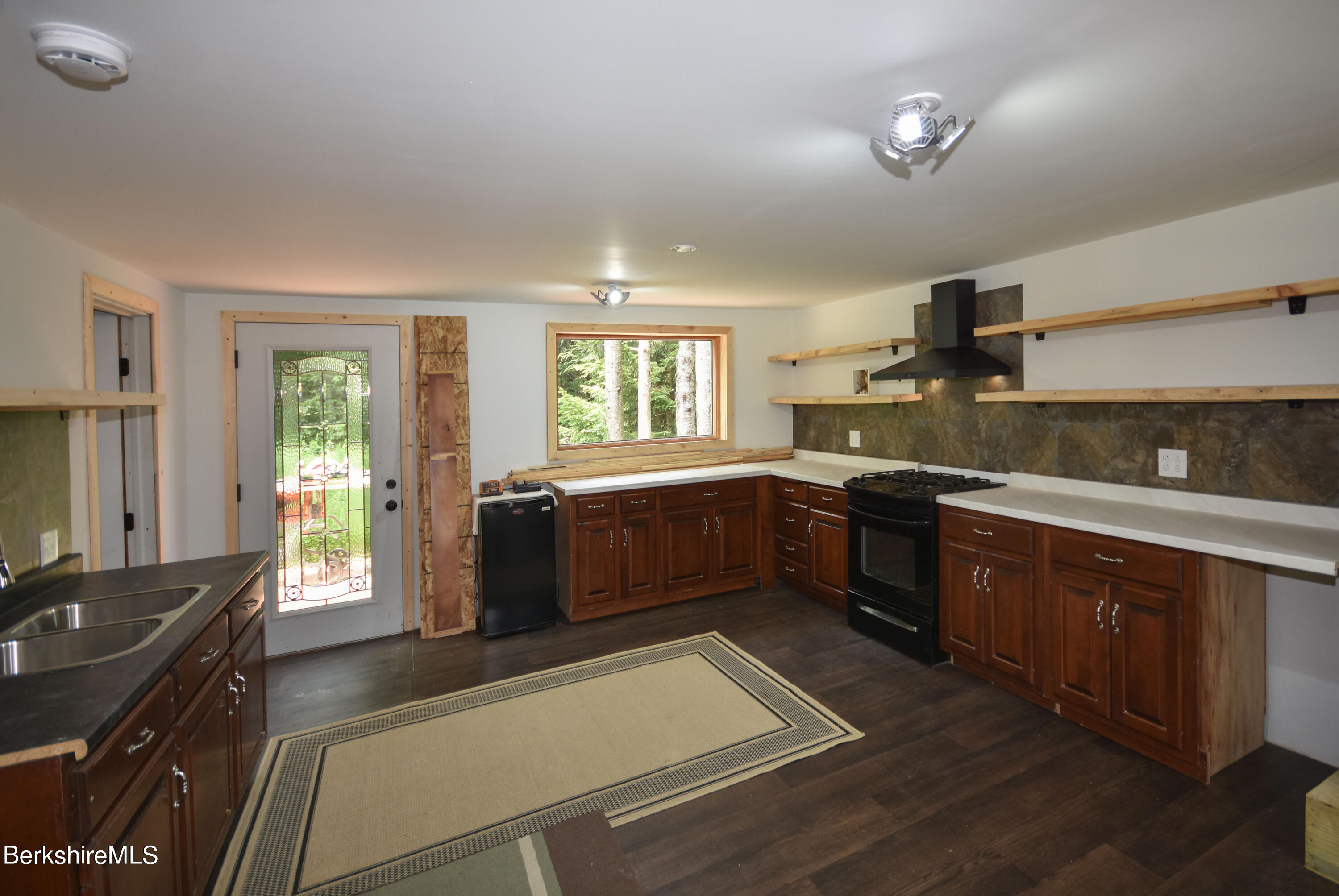 523 Center Road Savoy, MA 01256 - Photo 6 of 31 a kitchen with granite countertop a stove a sink dishwasher and a refrigerator