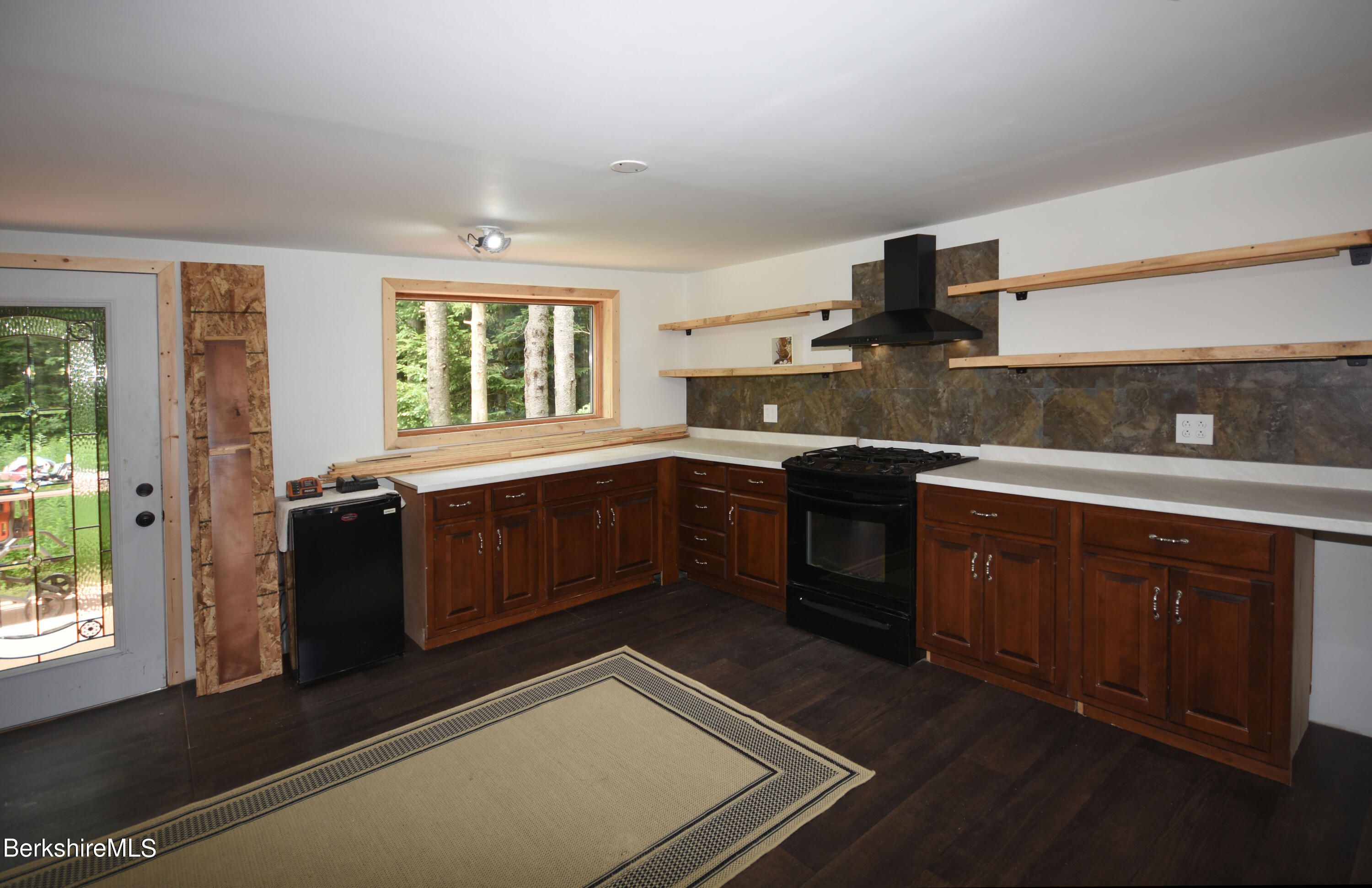 523 Center Road Savoy, MA 01256 - Photo 7 of 31 a kitchen with stainless steel appliances granite countertop a stove a sink and a microwave