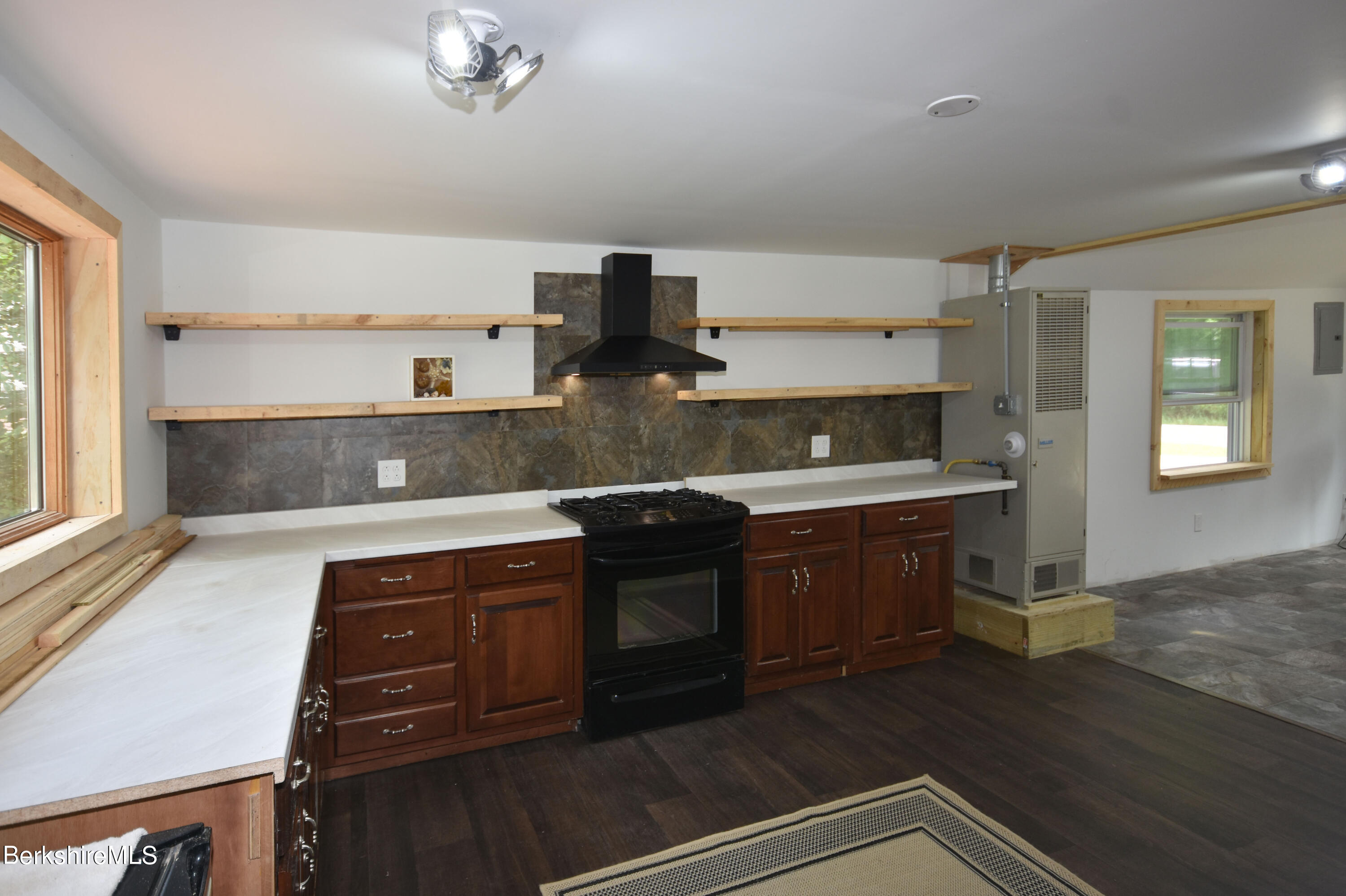 523 Center Road Savoy, MA 01256 - Photo 8 of 31 a kitchen with kitchen island granite countertop a sink cabinets and stainless steel appliances