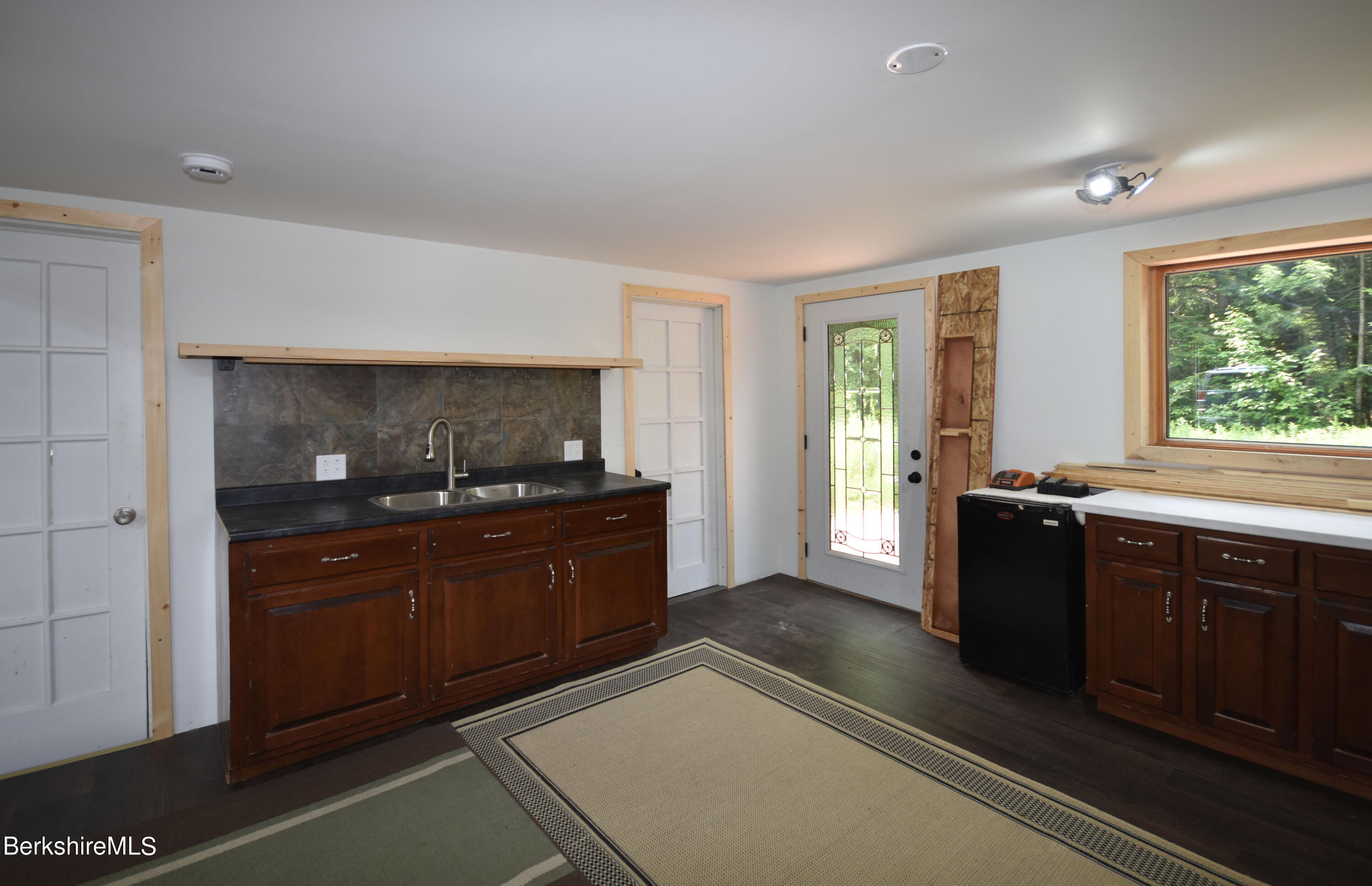 523 Center Road Savoy, MA 01256 - Photo 9 of 31 a spacious bathroom with a granite countertop sink and a large mirror